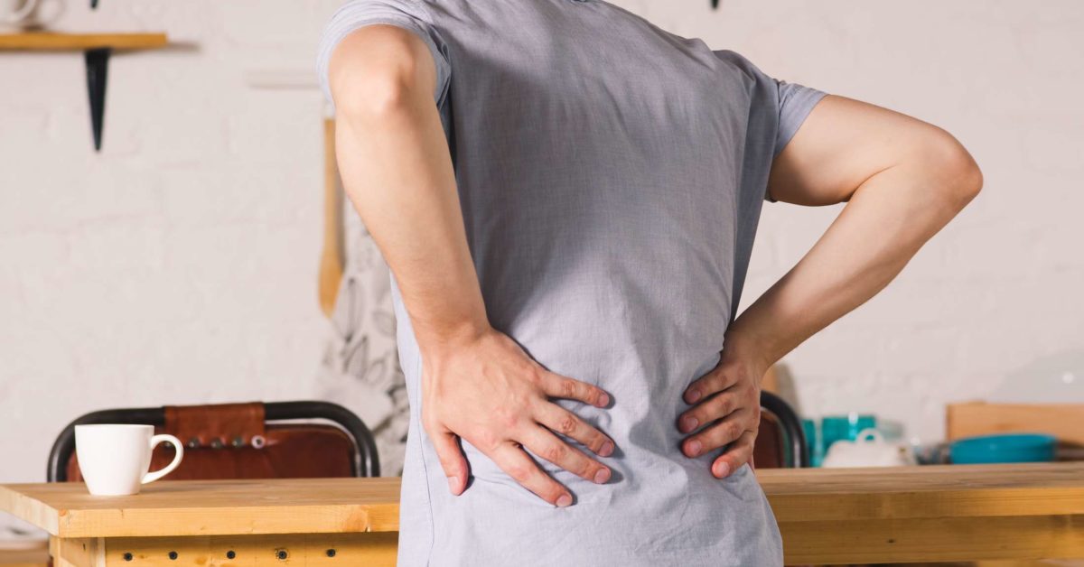 Can back pain be a symptom of prostate cancer?